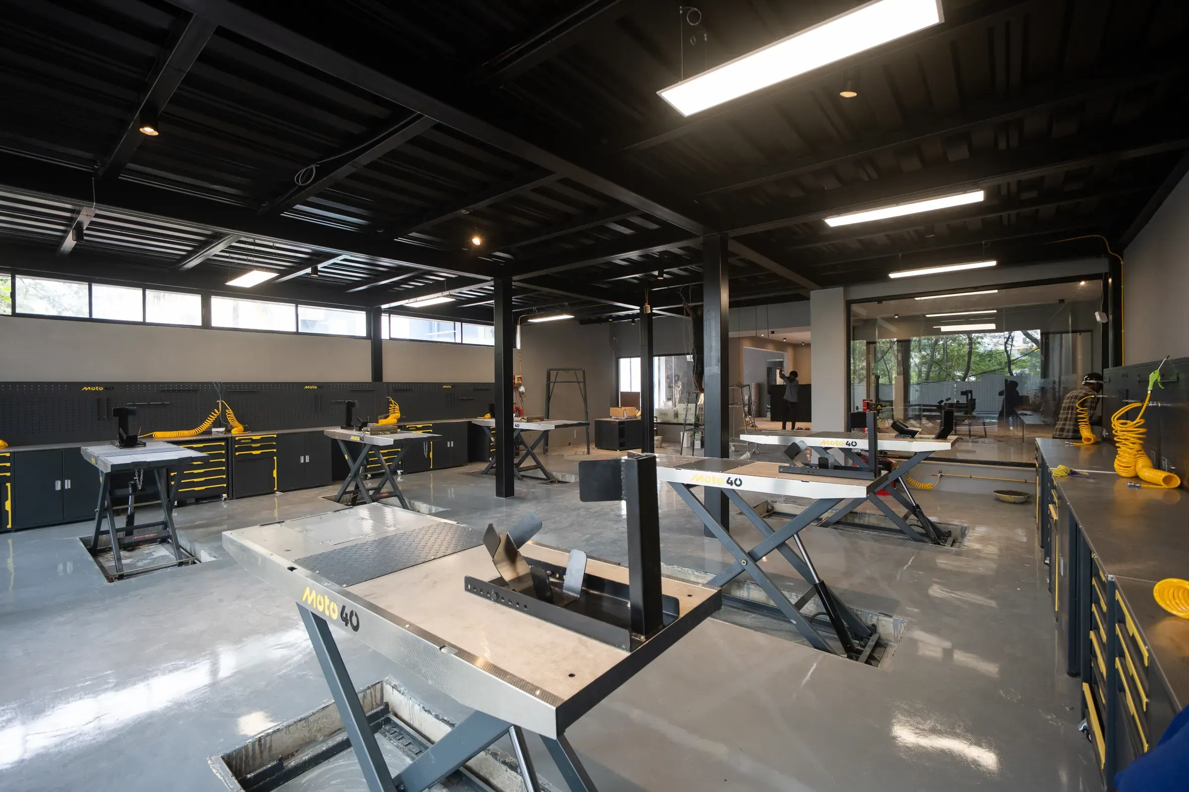 The open Moto40 workshop floor under its black steel roof
